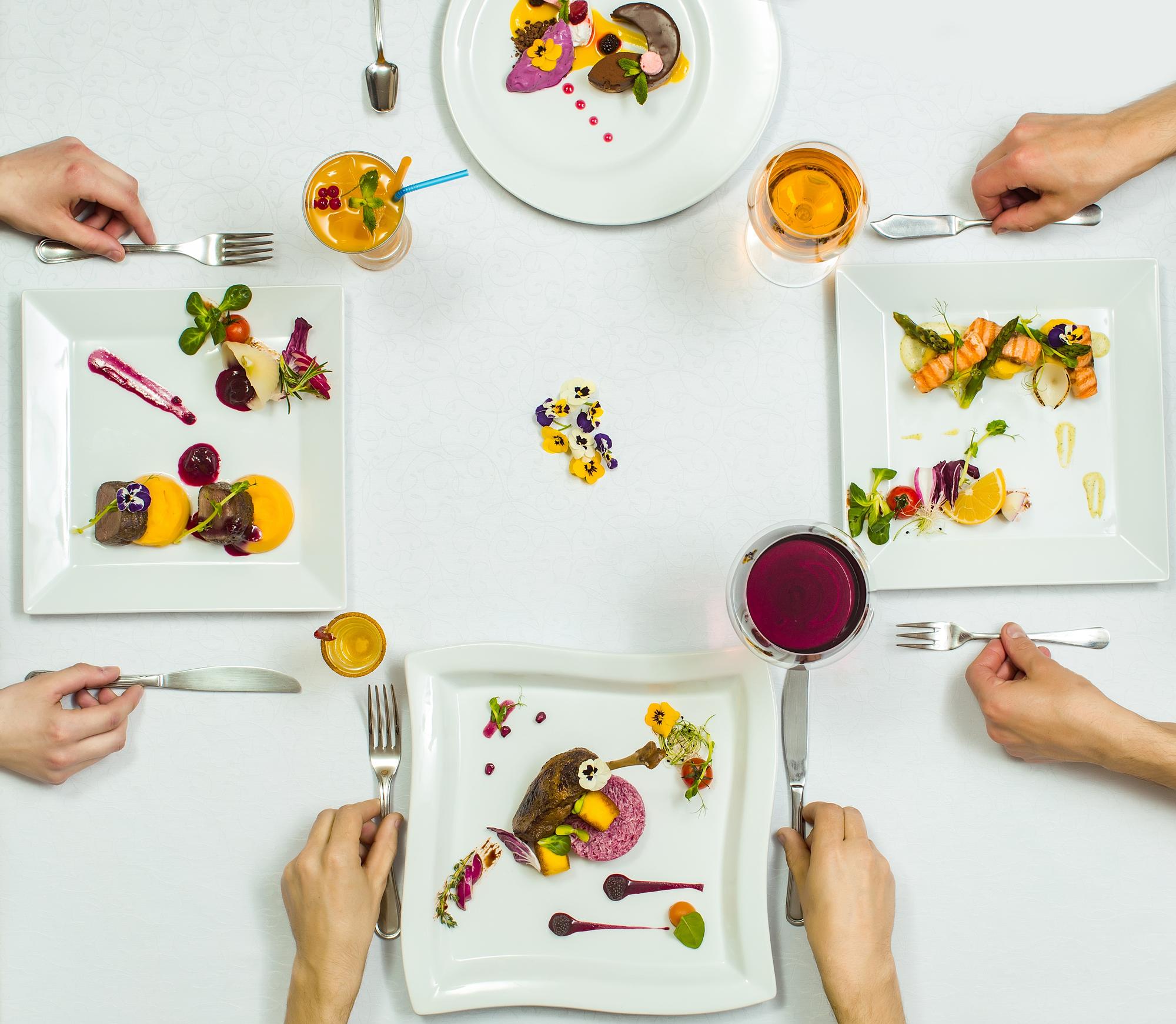 Participants tasting a plated dish in studio